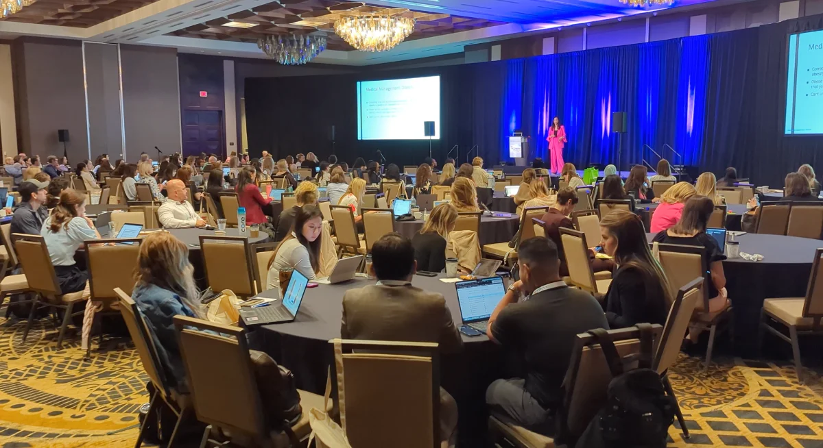 Attendees in the main session room